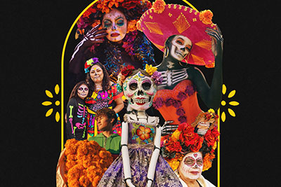 People in Dia De Muerto makeup with flowers and butterflies.
