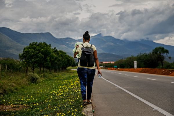Valentina Durán carries her infant son Samuel
